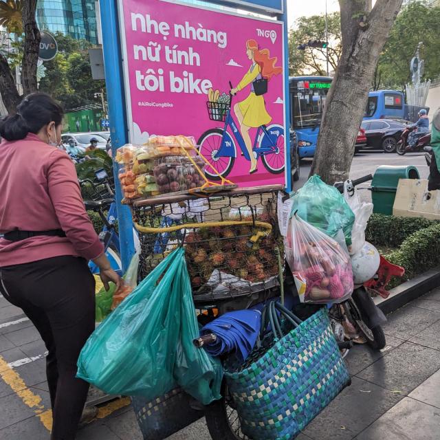 Woman selling food on mobile cart